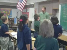 Jonah Lippert teachs Latin to the fourth grade class at Our Lady of Lourdes.