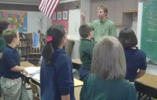 Jonah Lippert teachs Latin to the fourth grade class at Our Lady of Lourdes. 