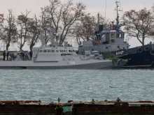 Seized Ukrainian military vessels are seen in a port of Kerch, Crimea, Nov. 26, 2018. Russian forces boarded and captured the ships Sunday. 