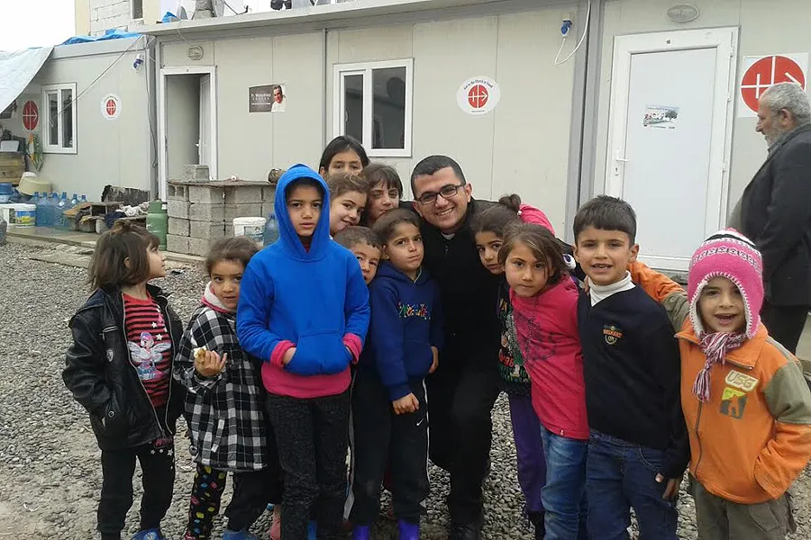 Seminarian Roni Marzina Momica with a group of children outside an Aid to the Church in Need office. Photo Courtesy of Roni Marzina Momica.?w=200&h=150