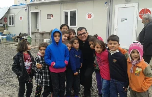Seminarian Roni Marzina Momica with a group of children outside an Aid to the Church in Need office. Photo Courtesy of Roni Marzina Momica.