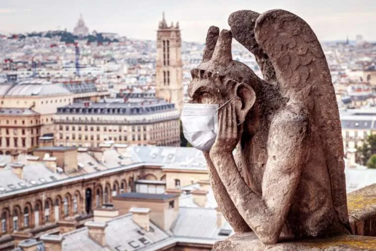 A medical maks on a gargoyle of Notre Dame in Paris. ?w=200&h=150