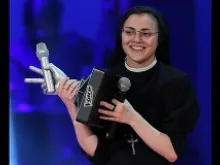 Singing nun Sr. Cristina Scuccia holds her trophy after winning 'The Voice of Italy' in Milan on June 5, 2014. 