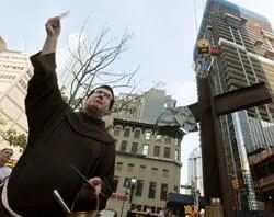 Fr. Brian Jordan stands in front of the World Trade Center cross. ?w=200&h=150