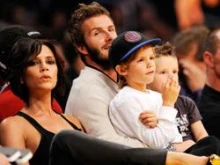 David Beckham and wife Victoria watch the LA Lakers play the Dallas Mavericks with their children Cruz (left) and Romeo (right). 