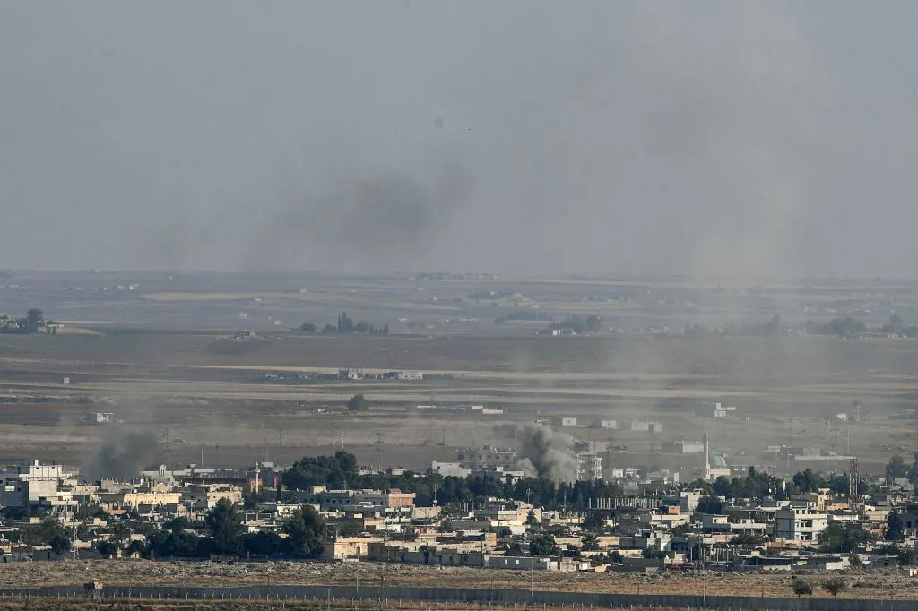 Smoke rises from the Syrian town of Ras al-Ayn during the Turkish offensive against Kurdish groups in northeastern Syria, Oct. 17, 2019, as seen from Turkey. ?w=200&h=150