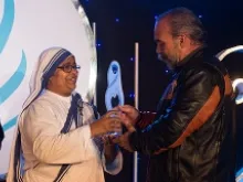 Sam Childers receives a 2013 Mother Teresa Award. 