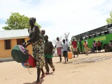 South Sudanese refugees arrive at a refugee camp in Uganda. 