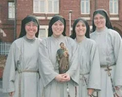 Sr. Jacinta Pollard holds a statue of St. Joseph and Jesus in a picture with some of her fellow sisters. ?w=200&h=150