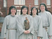 Sr. Jacinta Pollard holds a statue of St. Joseph and Jesus in a picture with some of her fellow sisters. 