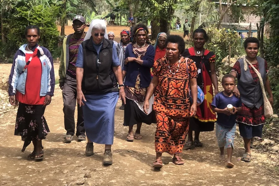 Sr. Lorena Jenal walks with local people from the Diocese of Mendi in Papua New Guinea. Courtesy Diocese of Mendi.?w=200&h=150