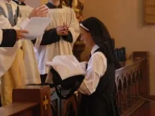 Sr. Marie-Celine receives her habit at her profession as a novice, Aug. 15, 2013. 