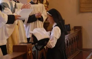 Sr. Marie-Celine receives her habit at her profession as a novice, Aug. 15, 2013.   Community of the Slaves of the Immaculate Heart of Mary.