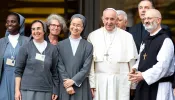 Sr. Alessandra Smerilli (second from left) and Sr. Nathalie Becquart (third from left) pose with Pope Francis and others during the youth synod in 2018.