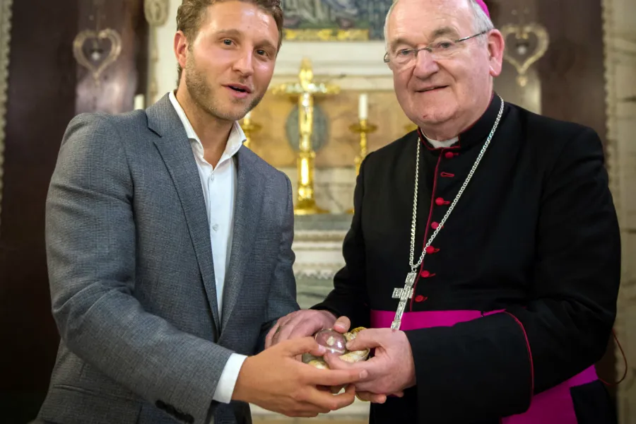 James Rubin, owner of Enviro Waste, presents the relic of St Clement to Archbishop George Stack of Cardiff at the Lady Chapel of Westminster Cathedral, June 19, 2018. ?w=200&h=150