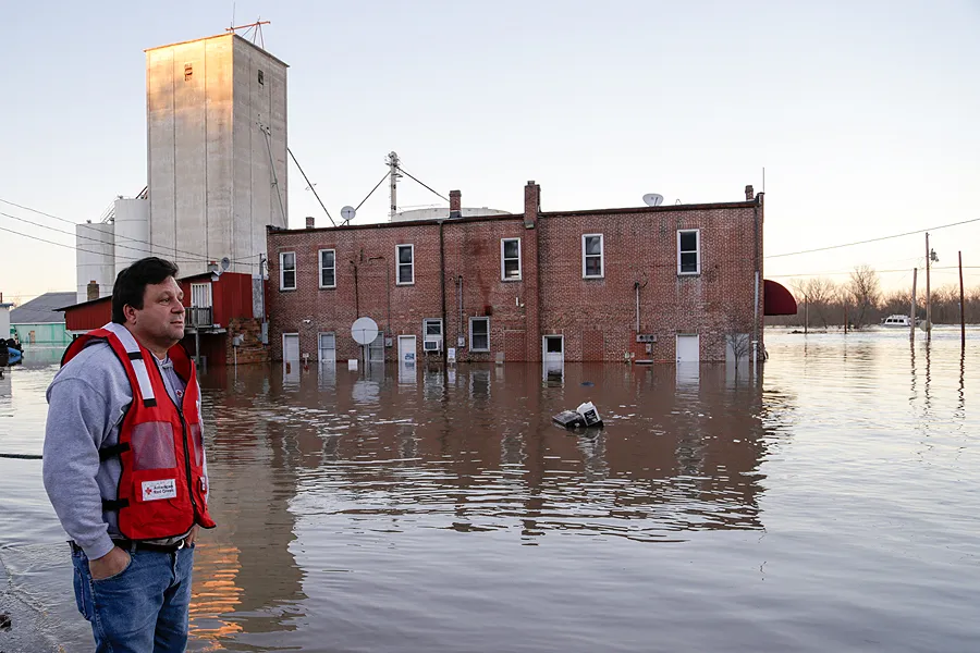 A relief volunteer surveys flood damage in Missouri. ?w=200&h=150