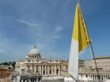 St. Peter's Basilica and the Vatican flag as seen from the colonnade