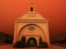 St. Vincent de Paul parish in Davenport, California, surrounded by an orange glow from an approaching fire. Photo provided by the Diocese of Monterey. 