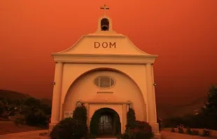 St. Vincent de Paul parish in Davenport, California, surrounded by an orange glow from an approaching fire. Photo provided by the Diocese of Monterey.  