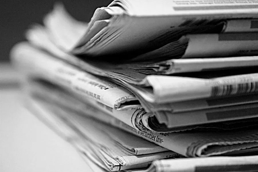 Black and white added stack of newspapers. ?w=200&h=150
