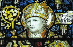 Stained glass of St. Patrick by C.E. Kempe in the church of St John the Baptist. Lawrence OP via Flickr. (CC BY-NC-ND 2.0).