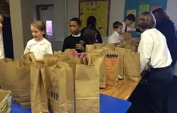 Students at St. Peter's School in Washington, D.C. make breakfast bags for the homeless. ?w=200&h=150