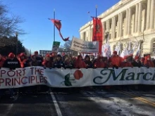 Students from Benedictine College in Kansas carry the March for Life sign at the head of the March, Jan. 22, 2014. 