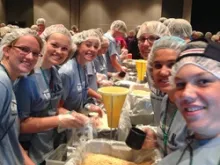 Steubenville conference teens package meals for the hungry in Burkina Faso, Africa. 