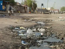 A ditch filled with sewage and garbage in a street of South Sudan. 