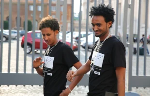 Survivors and family members of African migrants who perished in a 2013 shipwreck near Lampedusa in the Mediterranean sea leave an audience with the Pope, Oct. 1, 2014. Daniel Ibanez/CNA.