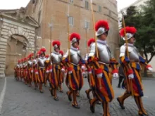 Swiss Guards march through Vatican City.