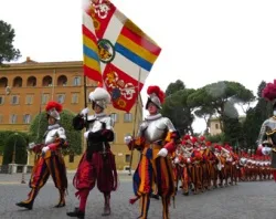 Swiss Guards march through Vatican City.?w=200&h=150