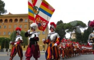 Swiss Guards march through Vatican City.
