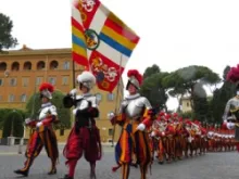 Swiss Guards march through Vatican City.
