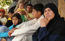 Noujad (far right) lost her husband to the violence in Syria, and her son is still missing. ?w=200&h=150