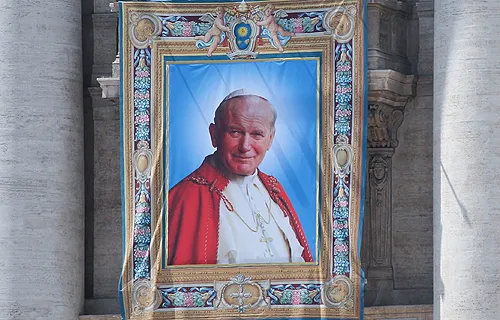 Tapestry of Pope John Paul II hanging from the facade of St. Peter's Basilica at the Vatican April 25, 2014. ?w=200&h=150
