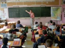 A teacher instructs his students. 