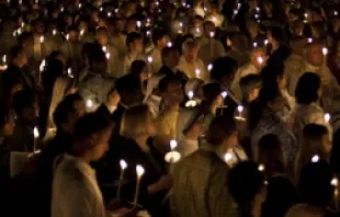 Catholics participate in the Easter Vigil.   Mazur.