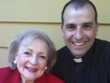 Fr. Andrews poses with Betty White