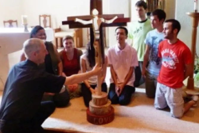 The Olympic Cross being blessed by Fr Simon with youth leaders from the Joshua Camp Credit The Catholic Church in England and Wales CNA World Catholic News 7 25 12