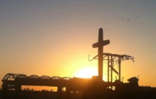 The cross of St. Mary's Catholic church surrounded by the frame of the former parish. Courtesy of Show Me the Ozarks Magazine by photographer Doug Hunt.