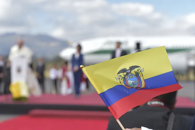 The flag of Ecuador with Pope Francis in the background upon his arrival in the country on July 5 2015 Credit   LOsservatore Romano CNA 7 5 15