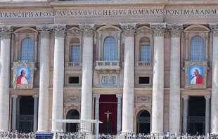 The images of Pope John XXIII and Pope John Paul II hanging from the facade of St. Peter's Basilica at the Vatican April 25, 2014.   Lauren Cater/CNA.