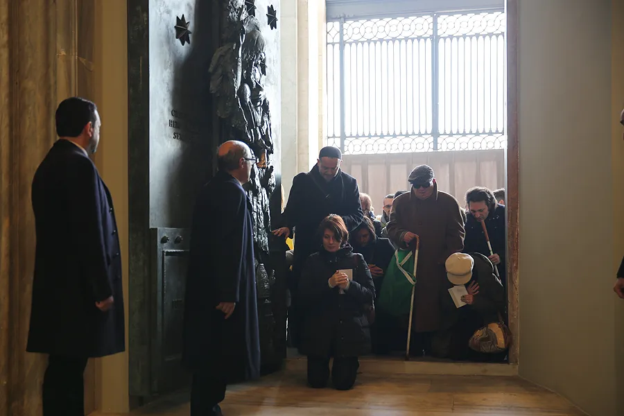 Pilgrims pass through the Holy Doors of the Archbasilica of St. John Lateran in Rome, Dec. 13, 2015. ?w=200&h=150