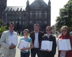 Thomas Peters of Catholic Vote and concerned members of the Georgetown community holds the four binders with more than 35,000 signatures.?w=200&h=150