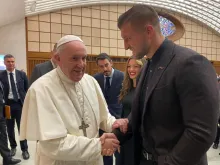 Pope Francis talks with Tim Tebow Feb. 5 at the Vatican's Paul VI Hall. 