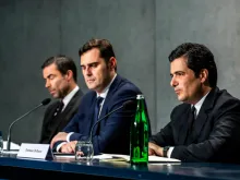 Tommaso Di Ruzza, right, speaks at a Vatican briefing alongside Alessandro Gisotti, center, and René Brülhart, left, May 21, 2019.