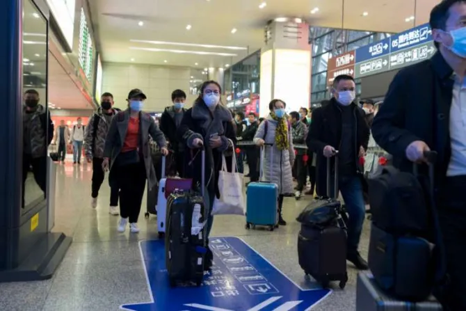 Travellers at an airport in Chengdu China wear masks to prevent infection from coronavirus Jan 23 2019 Credit BZhou Shutterstock