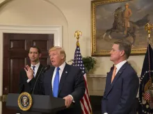 President Trump announces the introduction of the RAISE Act with Sen. Tom Cotton, R-Ark. (left), and Sen. David Perdue, R-Ga., at the White House, Aug. 2, 2017. 