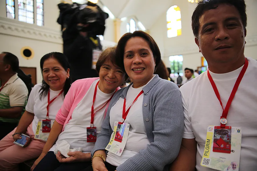 Typhoon Yolanda survivor Elena Garado (second from left) at the Cathedral of the Transfiguration of Our Lord, in Palo, Philippines, Jan. 17, 2015. ?w=200&h=150